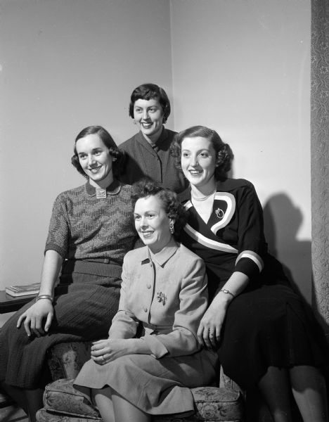 Group portrait of the officers of the Madison chapter of the Edgewood College Alumnae Association. They are Mary Conlin (in front), president; Mary Maurer (left), vice-president; Dorothy Dyke (right), public relations chairman; and Marcia Pilon (in the back), secretary-treasurer.