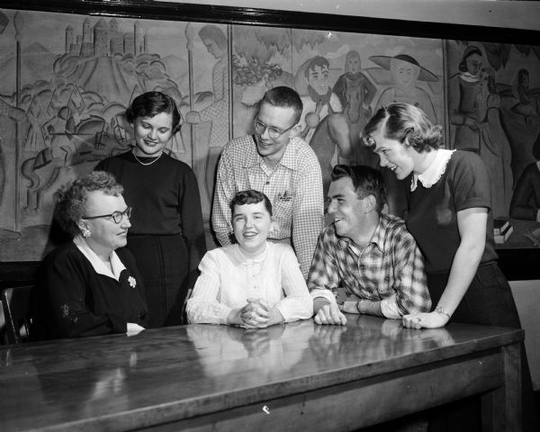 Members of the Madison Central High School committee plan the annual Student Council Faculty Tea. Seated are, left to right: Miss Elizabeth Ritzmann, adviser; Ann Holm; and Ralph Waggoner, chairman. Standing are, left to right: Betty Baron, Don McDaniel, and Doris Skaar.