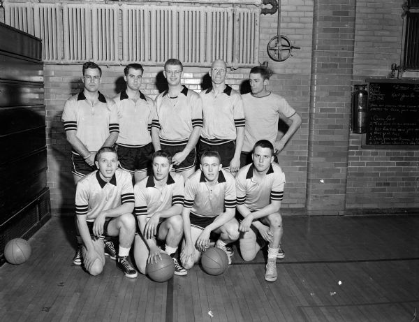 Randall State Bank basketball team, winners of the city basketball tournament championship.  Front row left to right: Dale Myrland, Silas Johnson, Carl Weston, Pete Stebbins. Back row: Bob Woodburn, Dale Bossenberry, Jack Wise, Don Page, Harold Carpenter.