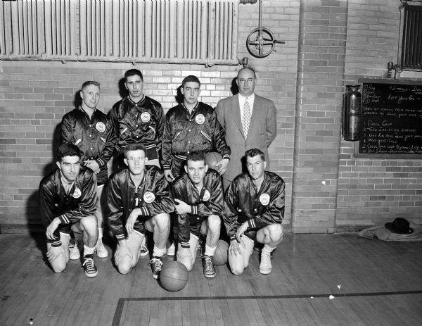 Group portrait of the Cuba Club basketball team, previous state champions, who lost in 1954 to the Randall State Bank team.