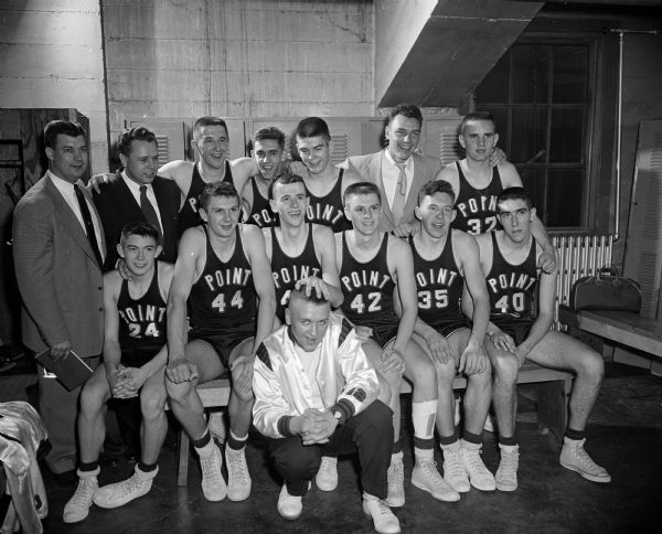 Group portrait of the Stevens Point basketball team with their coaches and manager. The Panthers were the 1954 high school state basketball tournament champions.