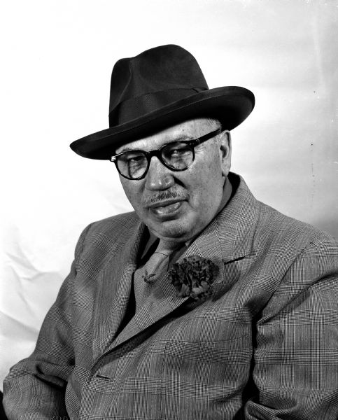 Portrait of Joe Mercedes of Rhinelander, Wisconsin. He was the Executive Director of the Wisconsin Tourist Bureau and publisher of at least 23 editions of "This is Wisconsin", a vividly-illustrated book promoting the state tourism industry.