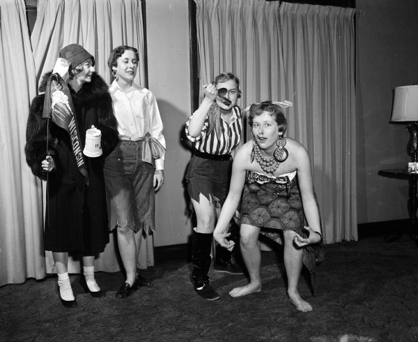 Four members of the Kappa Delta Sorority, 108 Langdon Street, pose in a skit which will be part of a dessert bridge benefit. Left to right: Jean Sawyer, East Troy; Marolyn Priehs, Mt. Clemons, Michigan; Lois Limpert, Appleton and Marcia Ritt, Racine.