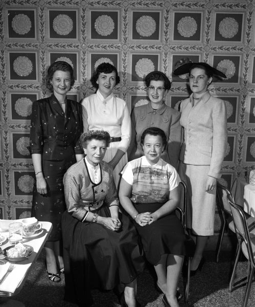 Group portrait of members of the committee planning for the spring luncheon of the Madison Women's Municipal Bowling Club. Left to right, sitting: Dorothy Jopke and Mary Tripalin.  Standing: Nina Richards, Dietrich-Denu Roman, Virginia Strand and Mrs. Forrest Badean.