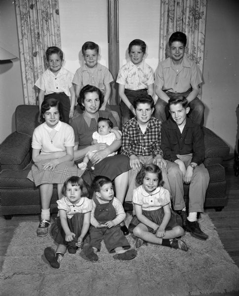 Group portrait of Catherine Kuehn with eleven of her twelve children.