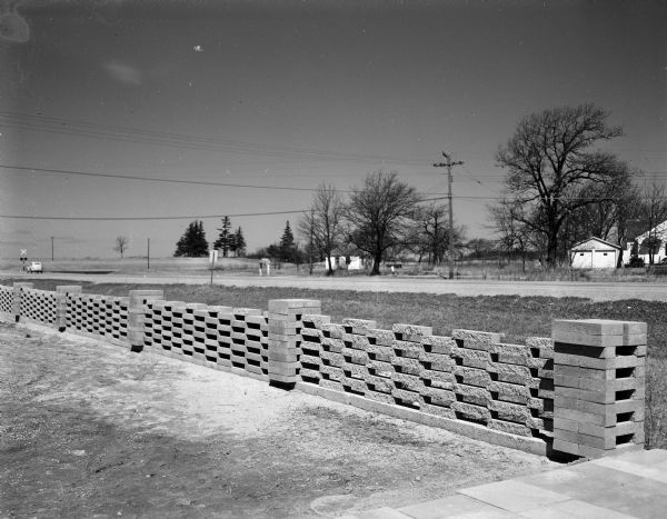 Sample fence made of concrete blocks from the Buildex Company, 4519 Beltline Highway.