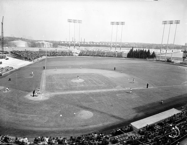 Elevated panoramic view of Milwaukee County Stadium showing the "batter's trees" in center field and a game in progress.
