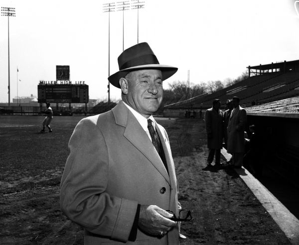 Portrait of Milwaukee Braves owner Louis Perini(?) in front of the dugout at County Stadium.