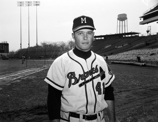 Portrait of Hall of Fame Milwaukee Brave infielder Eddie Mathews in front of the dugout at County Stadium.