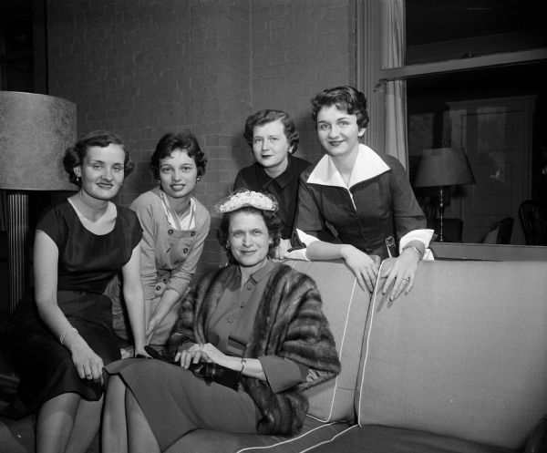Alpha Phi Mother's Club sponsors an Alpha Phi sorority musical program as a benefit party. Seated in foreground: Arrietta Hastings, president of the Mother's Club. Behind her, left to right, are four of the young women who will present the program: Barbara Moorhead, Jean Pankonen, Judy Conley, and Kathleen McGrath.