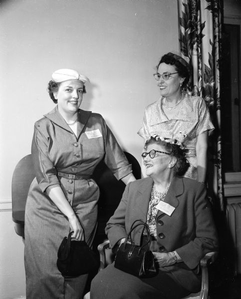 An interest in advertising drew this group together at the Ladies of the Press Breakfast. Mrs. Lillian Milroy is seated; Margot Eskridge is at left and Grace Kennedy is on the right.