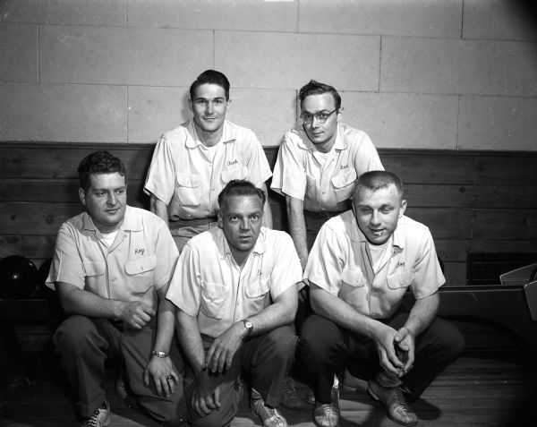 Group portrait of five bowlers.