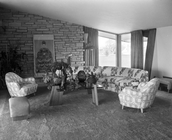 Living room of the C.S. Gonstead home in Mt. Horeb, designed by Madison architect Herbert Fritz, built in 1951, and severely damaged by fire in 1991. The accompanying newspaper article describes some of the architectural highlights and the decorative features added by the Gonsteads, especially their Chinese and Japanese furnishings and ornaments.