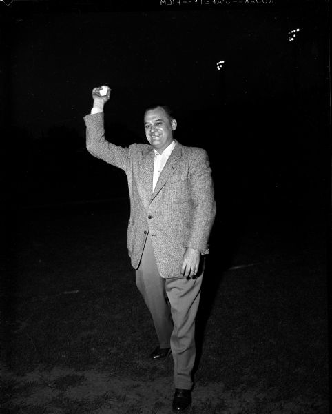 Madison mayor George Forster prepares to throw out the opening pitch at the first game of the Madison Baseball League, successor to the old Industrial League. The game was held at Breese Stevens Field.