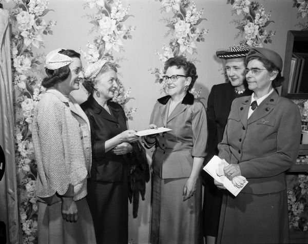 Officers of Zonta International of Madison, a professional women's service organization, present a contribution to Hear, Inc., a new organization for hearing education and rehabilitation. They include, left to right: Helen Engle; Evelyn Clauder; Gwendolyn Settle and Hazel Immel, officers of Hear, Inc.; and Mrs. Cass Williams.