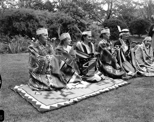 View of the ceremonies of the Nakoma Welfare League installation of officers, held outdoors at the Anderson home, 4014 Cherokee Dr. Left to right: Helen Herrick, Mrs. John Bell, Vera Tramberg, Ida Huff, Lillian Honeck.