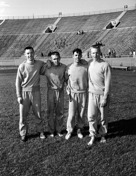 Group portrait of Port Washington's 880-yard relay team that set a new record for Class B at the state high school track meet at Camp Randall Stadium. From left are: Bill Eisentraut, Don Steller, Tom McGaw, and John DeMerit.