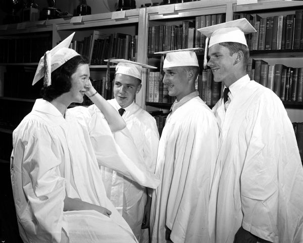 Group portrait of four graduating seniors from Wisconsin High School chosen to speak at the graduation exercise. From left are: Elizabeth McCanse who gave the address of welcome; Stephen Coughlin, class orator; Roderick Groves who gave the address of farewell; and Donald Aitken who gave the class history.