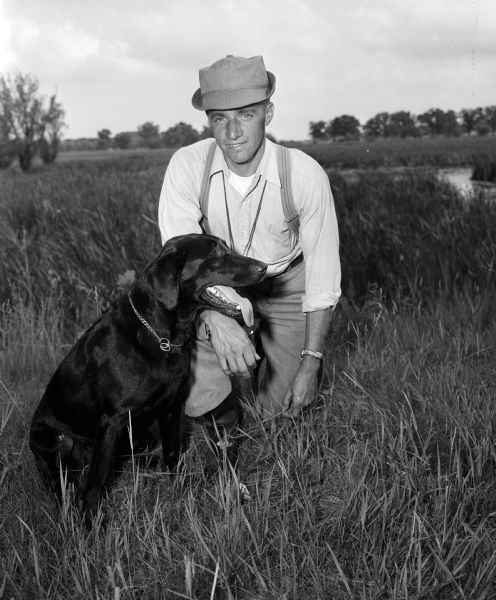 Roy Ackerman of Muskego is shown with his dog, Jet Panther. The dog was a champion in the Wisconsin Retriever field trials at Westport.
