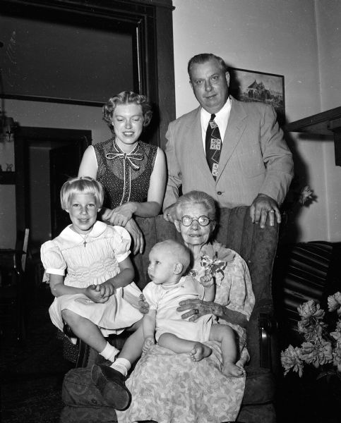 Group portrait of four generations gathered at the home of 91-year-old Carrie Lunda. She is shown with her son, Ernest M. Lunda of Muskegon, Michigan; her granddaughter Claire Lunda Gropp of New York City, and her great-grand children Leslie Groppa, 4 years old, and Douglas Gropp, 6 months old.