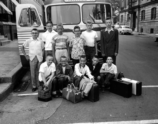 Portrait of the eleven <i>Wisconsin State Journal</i> newspaper carriers who won three-day trips to Chicago and Milwaukee in a subscription contest sponsored by the circulation department.