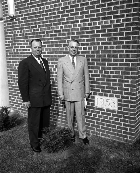 Bethany Evangelical Free Church pastor Bernhard Rom (right) stands with Cr. Arnold T. Olson of Minneapolis at the dedication of the church's new education building. Mr. Olson was the main speaker at the service.