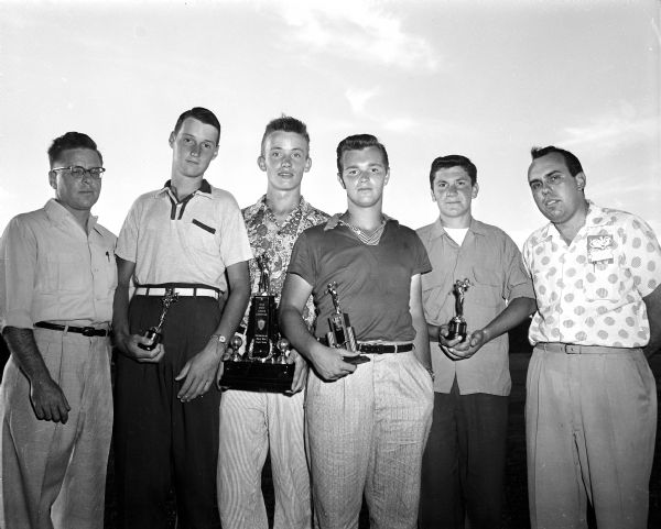 Roy Gregson and Gene Young, co-chairmen of the State Junior Chamber of Commerce golf tournament, stand at either end of the four boys who earned trips to the National JCC meet in Alburquerque, New Mexico. They are, from left: By Prentice, Green Bay; John Cartwright, Madison; Bernie Coughlin, Madison; John Pientkowski, Sheboygan.
