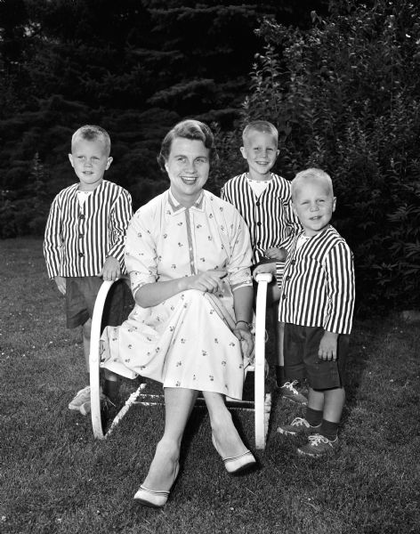 Portrait of Jane Weston Johnson and her three sons, left to right: William, David, and Peter. They are from Rocky River, Ohio and are visiting the home of her parents, Dr. and Mrs. Frank Weston, 166 Lakewood Boulevard.