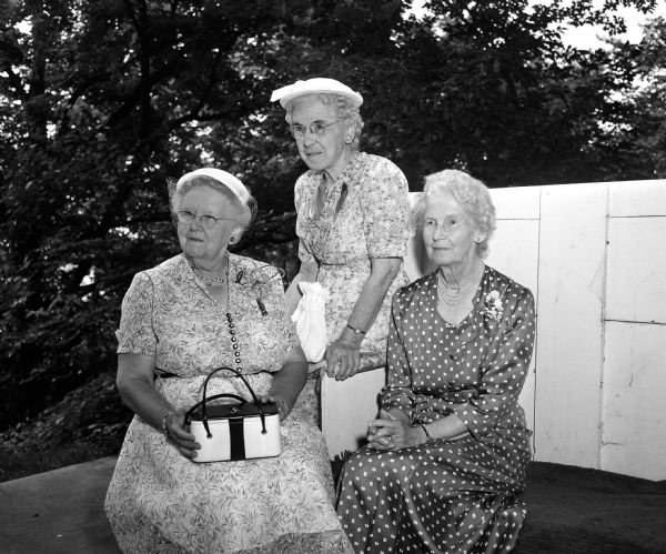 Three long-time Presbyterian women leaders posing for a portrait on the terrace at 739 Farwell Drive in Maple Bluff. They are, from left, Lota Reid, Minnie Hastings, and Grace Ramsey.