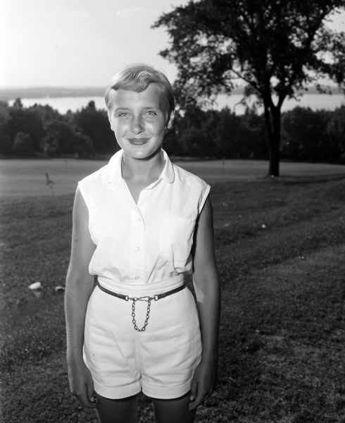 Portrait of sixteen year old Marilyn Hall, the 1954 junior champion of the Wisconsin Women's Golf Association. The tournament was held at the Blackhawk Country Club.
