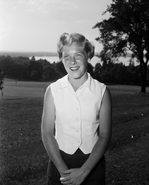Portrait of fifteen year old Jeanne Glaub of Wauwatosa, third place winner in the Wisconsin Women's Golf Association junior championship tournament played at Blackhawk Country Club.
