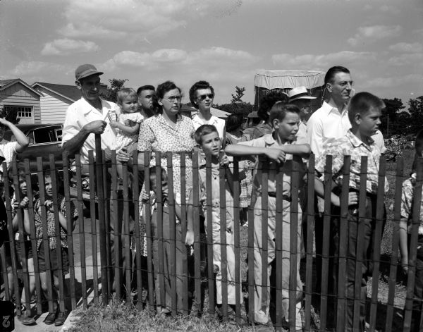 Some of the crowd watching the 1954 Madison soap box derby, including the Wilbert Rung family of Madison.