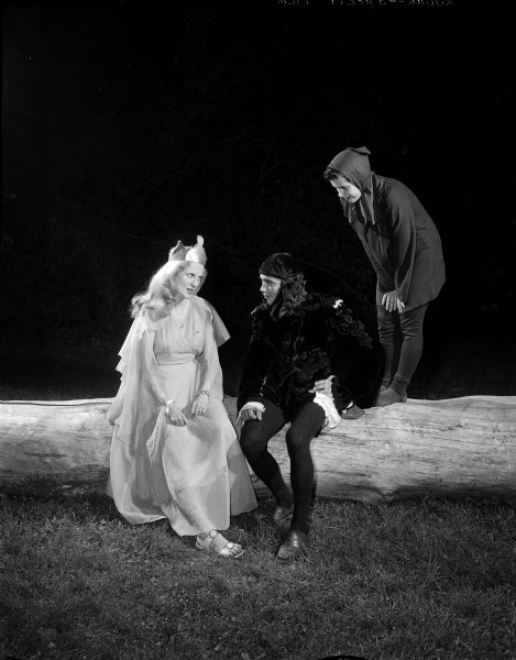 A scene from the Mineral Point Players' production of Shakespeare's "A Midsummer Night's Dream." Actors in costume, left to right: Myra Pilling as Titania, Walter Harris as Oberon, and Sharon Holland as Puck.