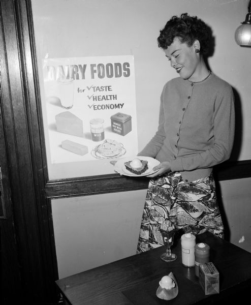 A woman demonstrates a diet with dairy foods at the Wisconsin State Fair.