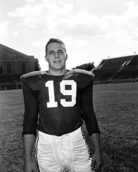 Portrait of a University of Wisconsin football player wearing jersey #19.