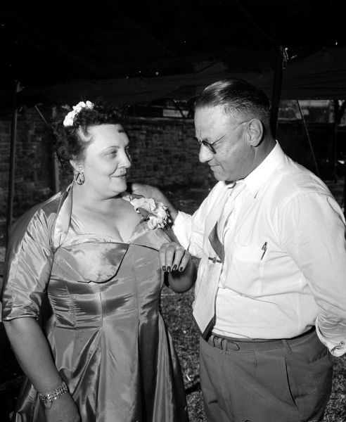 Mrs. Evelyn Gotzion of 3222 James Street in Madison, Labor Day Queen, shows her ring to Orla Coleman, president of the Madison Federation of Labor. The ring was one of her prizes.