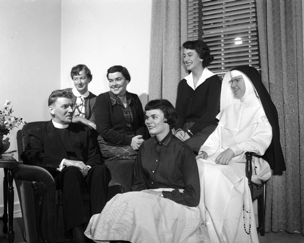 Reverend Jerome Mersberger (left) and Sister Mary Nona, O.P. (right) meet with Edgewood College students during a three-day leadership school for class officers. Students include, from left: Vivian Long, Madeline Farrell, Mary Alice Clark, Josephine Gerami.