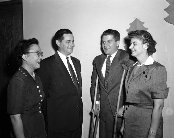Three persons attending the Christian character research project workshop at the First-University Methodist Church discuss the program with the executive secretary of the project, Reverend Leonard Sibley, Jr., from Union College in Schenectady, New York. Left to right are: Mrs. James Hara, J.M. Sparkman, Reverend Sibley, and Viola Hunt.