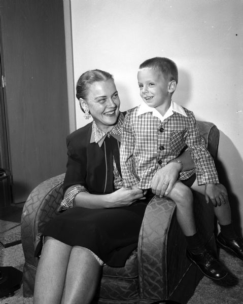 Portrait of new Madison residents Doris Morgan and three and a half year old son, Gary, after arriving in Madison. Husband and father Thomas Morgan is now a general representative of the American Federation of State, County, and Municipal Employees. Doris Morgan is a former society editor of the <I>Milwaukee Journal</I>.