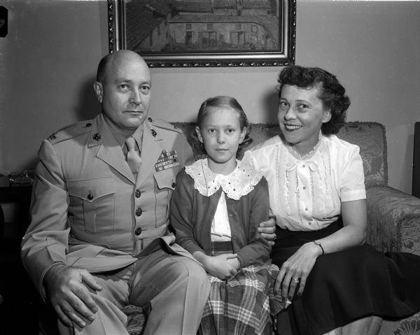 Group portrait of new Madison residents Colonel Douglas and Mary Reeve, with their daughter Linda (age 11). They recently came to Madison from Newport, Rhode Island when Colonel Reeve became professor of naval science in the University of Wisconsin ROTC program.