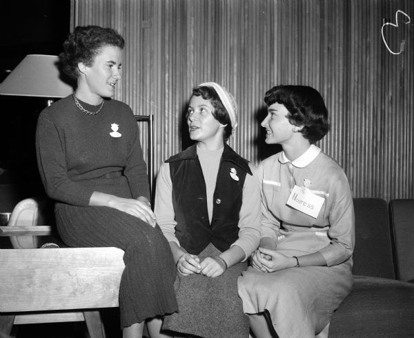Three student nurses from three Madison hospitals get together to 'talk shop' at the convention. Left to right are Barbara Gee, University Hospitals, Mary Blum, Madison General, and Nancy Miller, Methodist. Miss Blum was chairman of the convention, which was attended by student nurses from all over the state.