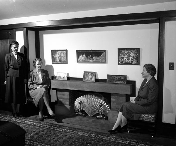 The Gilmore House, located at 120 Ely Place and designed by Frank Lloyd Wright, is one of the homes on the League of Women Voters benefit tour. Sitting in the living room near the fireplace, left to right, are: Nellie Weiss, Elizabeth Lord, Josephine Jenkins.