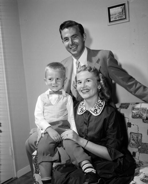 Portrait of assistant professor George W. Sledge of the 'new' agricultural and extension education department. Also shown are George, Jr., age 3, and Mrs. Sledge.