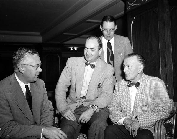 General sessions of the fifth annual meeting of the National States' Conference on Alcoholism were held at the Hotel Loraine. Left to right are Ernest A. Shepherd, Avon Park, Florida, conference president; H. David Archibald, Toronto, Ontario; Raymond G. McCarthy, New York, New York, executive committee member; and Gerald F. McGill, 933 East Gorham Street, director of the Wisconsin State Bureau of Alcohol Studies, host to the conference.