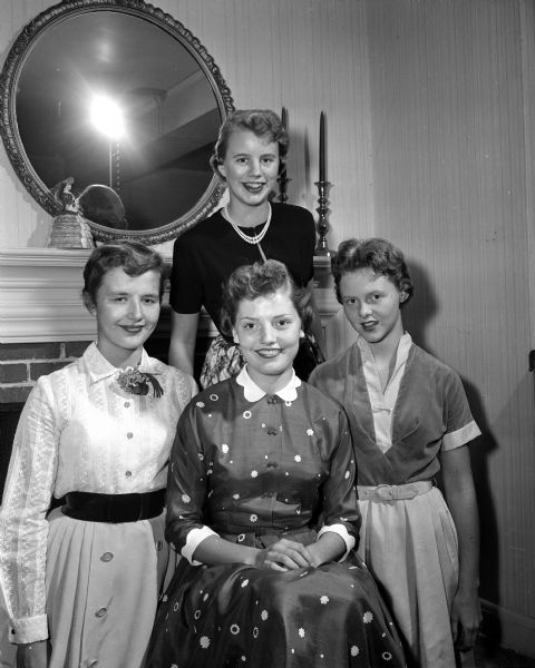 West High School Homecoming Queen Sarita Sarig (center) poses with her Court of Honor, including Gail Lawrenz (left), Sally Arnold (standing), and Priscilla Butts (right).