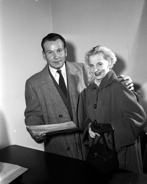 Portrait of Fricis Brakmanis, age 41, and his bride-to-be Maija Smeils, 40, holding their wedding license. Both had spent time in Latvian forced-labor camps during World War II. Neither of them had heard from their former spouses since they were separated in war labor camps in 1944. They waited four years while their marital statuses were verified.