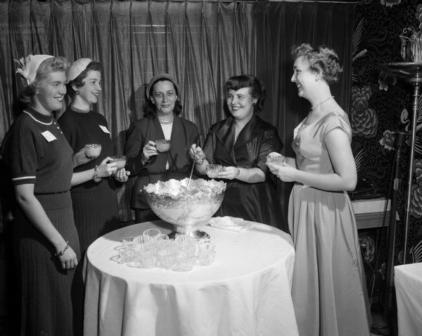 Women participate in the Sigma Alpha Sigma sorority rushing tea at the Edgewater Hotel. They include, from left, Shirley Belgen, Dolores Rolstad, Muriel Davis (national president), Ethel Yank, and Joyce Goetsch.