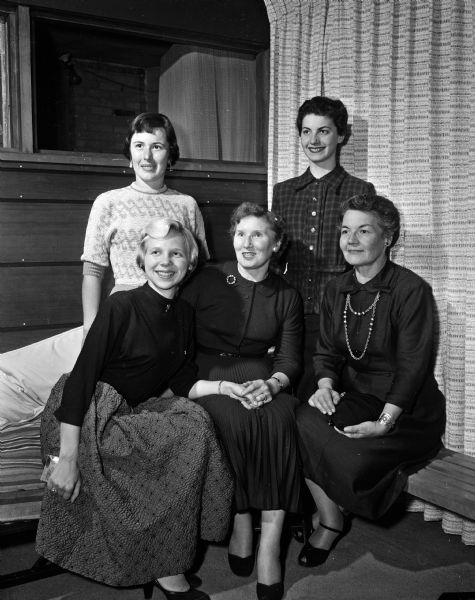 Portrait of five officers of the Alpha Phi sorority. Back row, left to right: Mrs. Alfred Meeg, Highland Park, IL, district governor; and Mrs. James W Barton, Highland Park, IL, director of extension. Front row: Carol Nemec, president of the pledge class; Nancy Knight, president of the Madison alumnae chapter, and Nancy Rusy, president of the UW chapter.