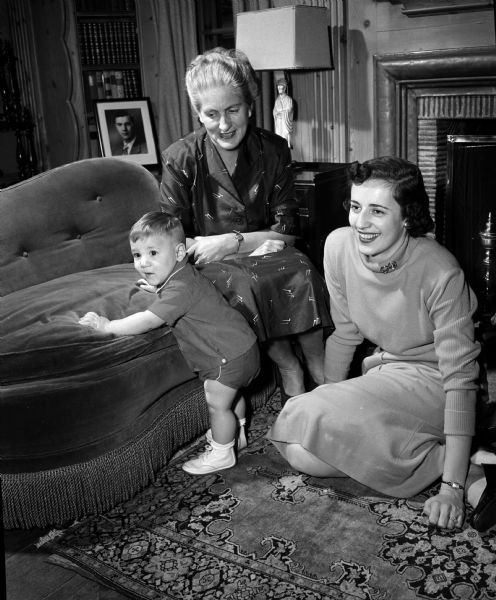 Portrait of two women and an infant as they celebrate a three-generation Thanksgiving gathering at the Rendall home. William "Jay" Rendall, 9 months; Joan Rendall, mother; Marguerite Rendall, grandmother.