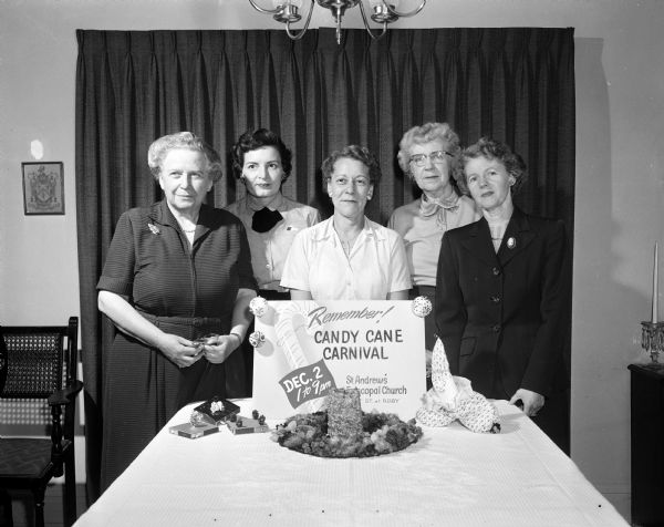 Members of the St. Andrews Episcopal Church Women's Auxiliary plan a "Candy Cane Carnival." Left to right are: Mrs. Frank S. (Virginia) Moulton, Mrs. John H (Gladys) Buck, Mrs. Kenneth C. (Annette) King, Mrs. E. Cadwallader (Alice) Smith, and Mrs. Edwin P. Archibald.